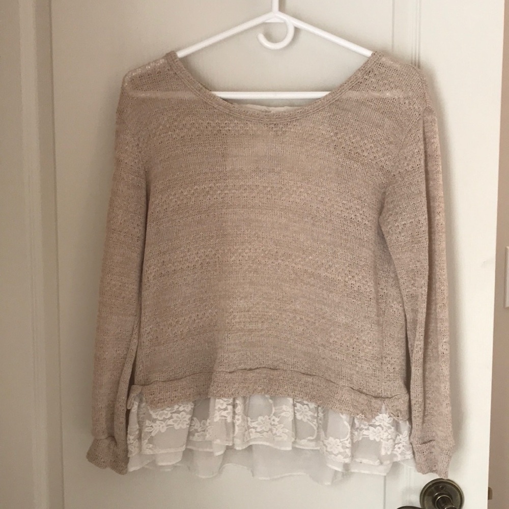 Light knit sweater with lovely lace detailing.